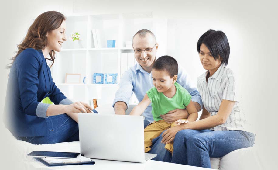 Image of a family looking at a computer screen
